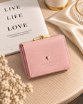 Pink Sweet Dream compact wallet on cream table setting