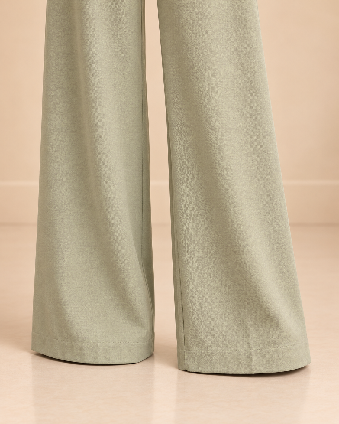 Sage green wide-leg pants hem detail