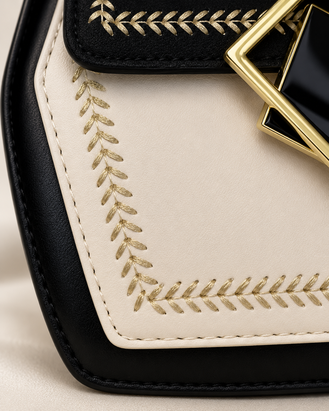 Cream front panel texture and gold embroidery detail