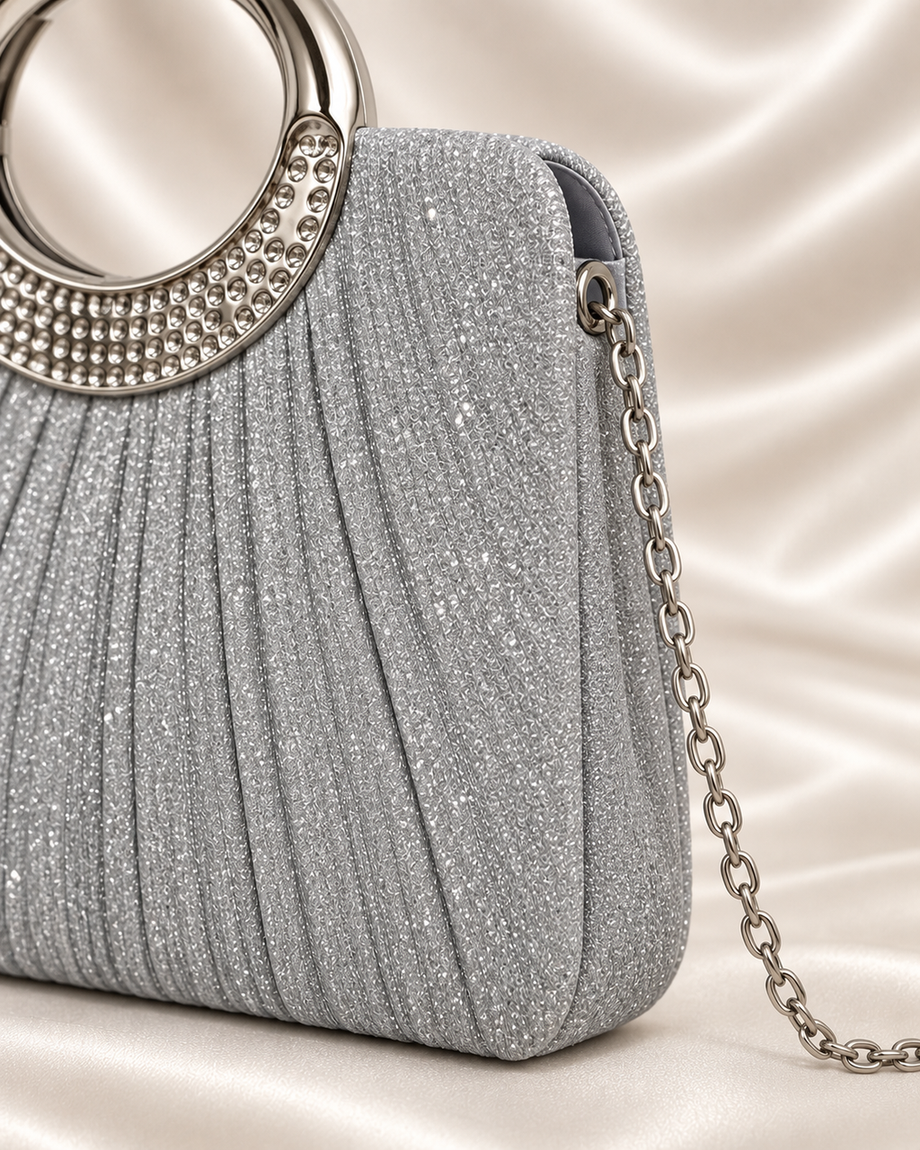 Side and chain detail of silver glitter evening bag