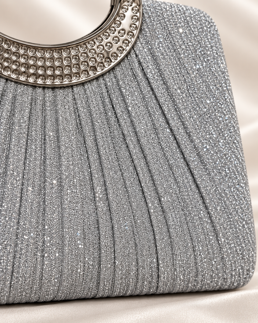 Close-up of silver glitter pleated fabric texture