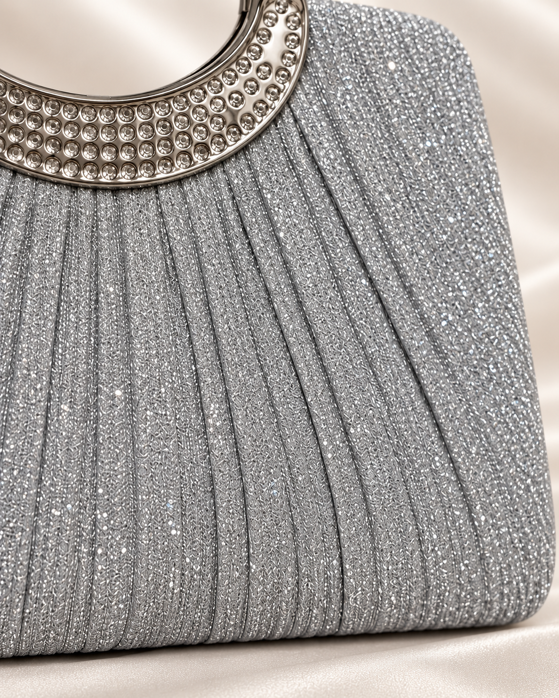 Close-up of silver glitter pleated fabric texture