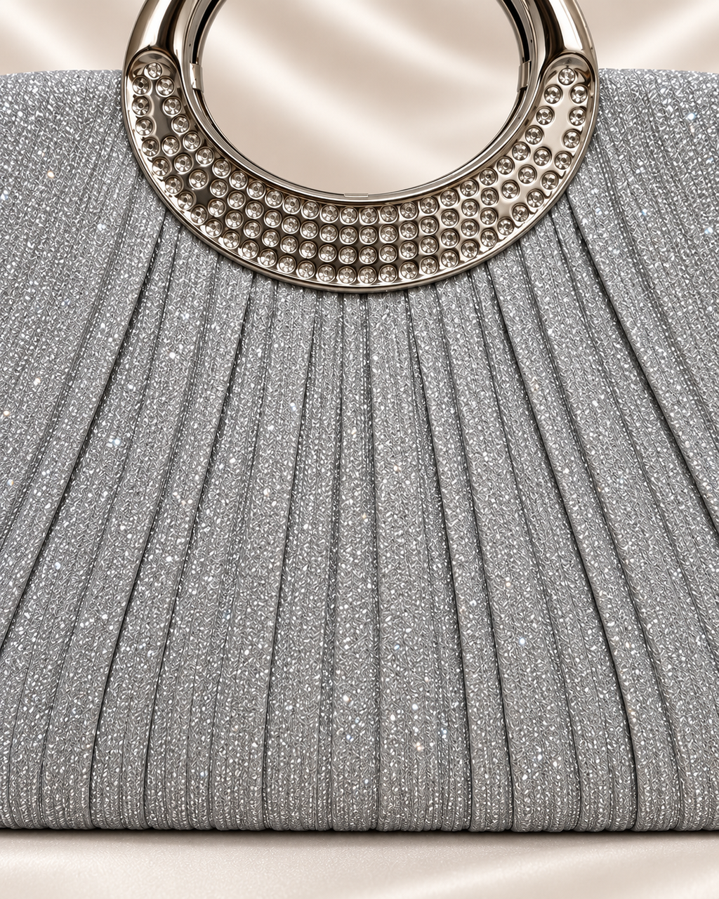 Front detail of silver glitter pleated evening bag