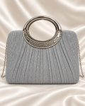 Silver glitter evening bag with rhinestone circular handle