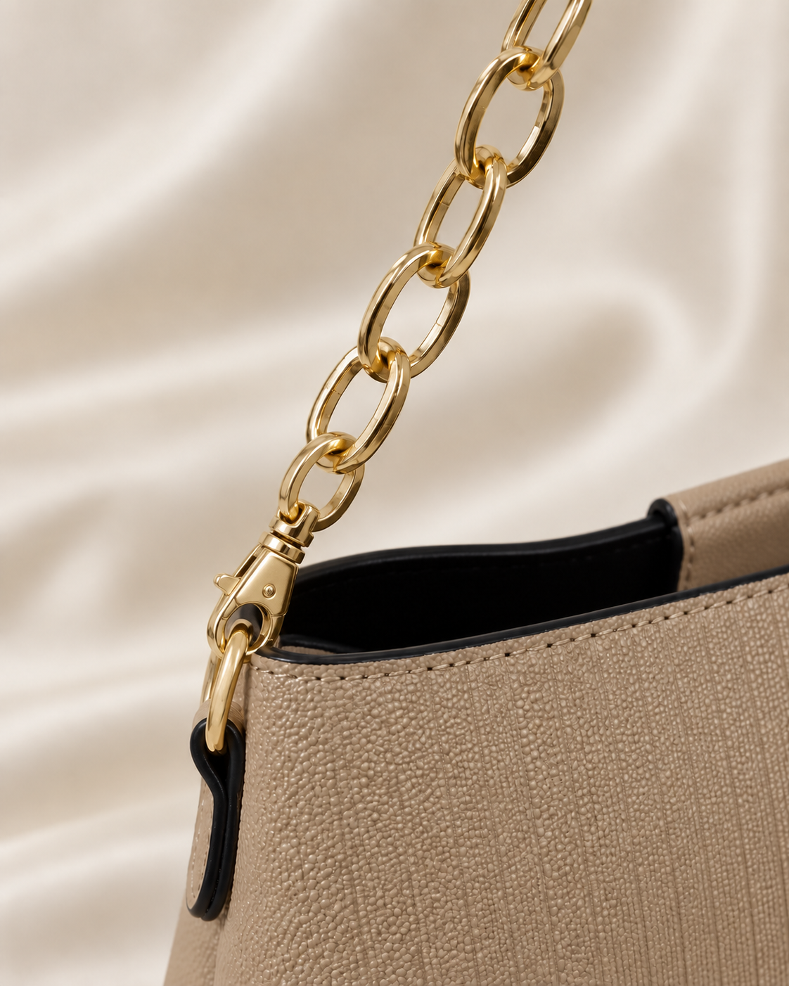Taupe handbag gold chain and detachable clasp detail