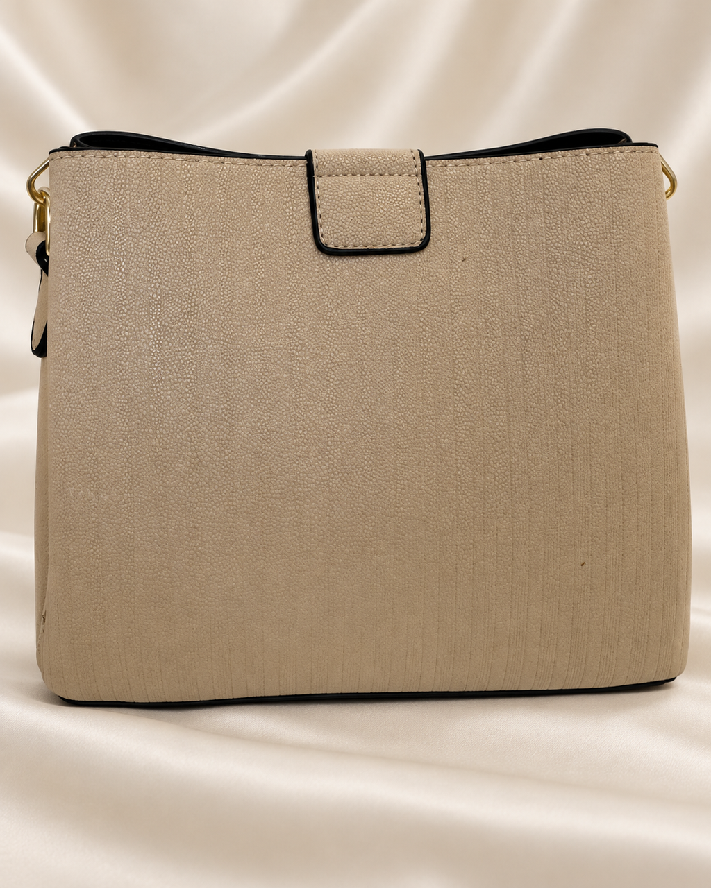 Taupe handbag rear panel and tab detail