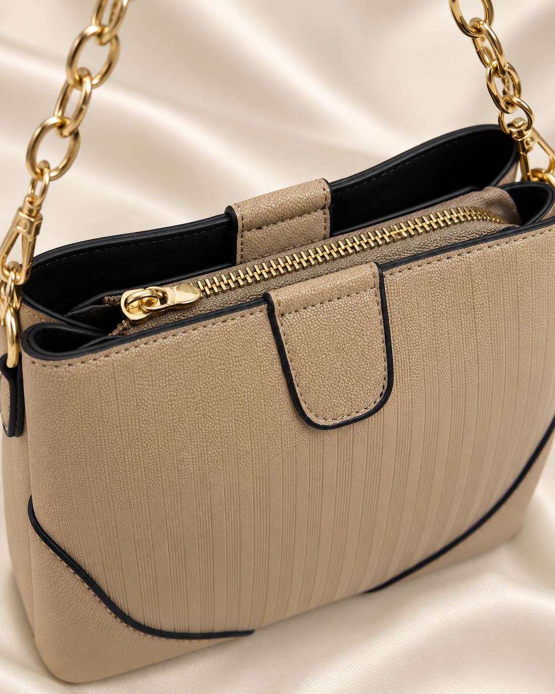 Taupe handbag top zipper and lining detail